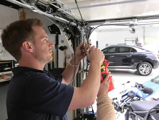 Oxford Garage Door Repair safety certified technician performing cable replacement in Oxford