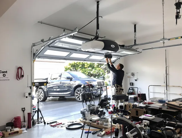 Oxford Garage Door Repair specialist installing smart garage door opener system in Oxford home