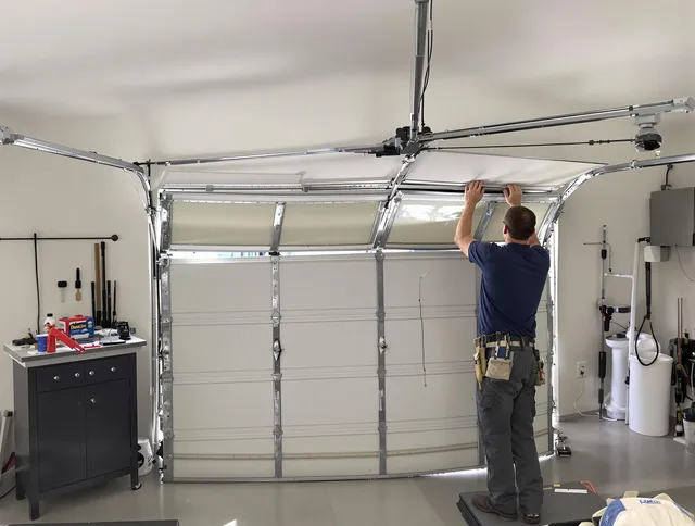 Oxford Garage Door Repair specialist performing precise section replacement on Oxford garage door
